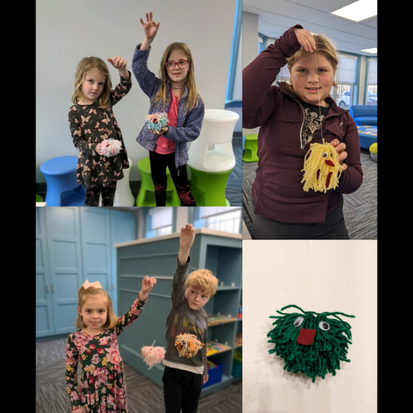 The children showing off their yarn monsters